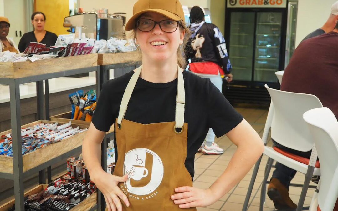 Gillian with apron and cap working at Cafe J